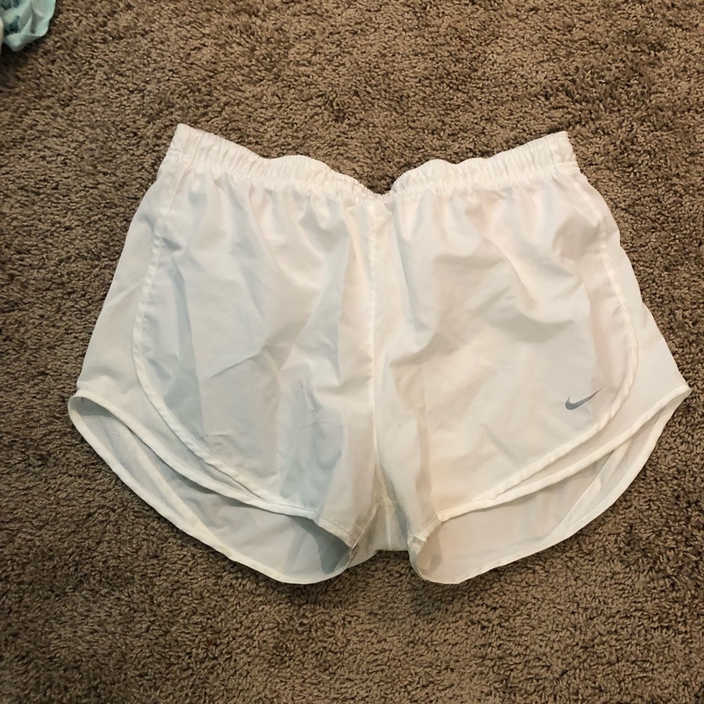 White Nike running shorts